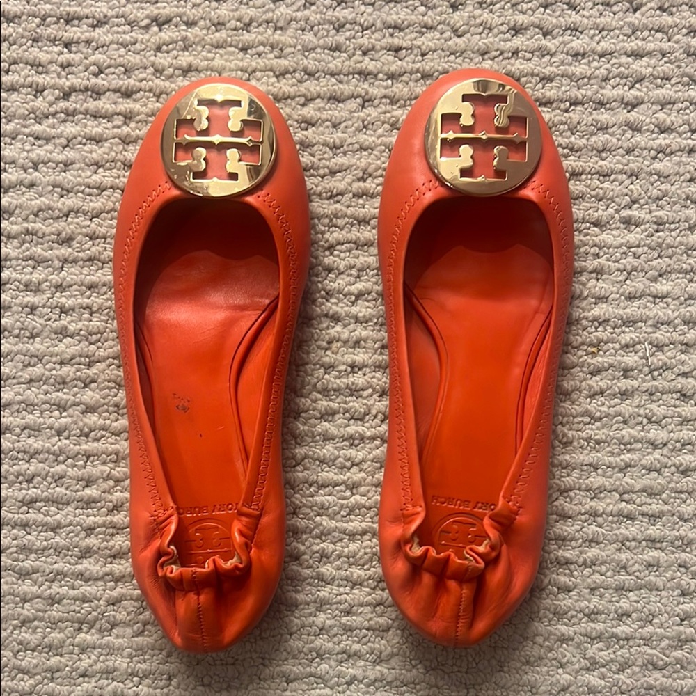 Tory Burch Bright Orange Flats with Gold Emblem